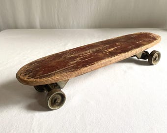 Vintage Metal Wheel Skateboard · Narrow Plank Deck · Early Skate Culture · 50s to 60s
