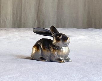 silver metal rabbit figurine · 4" long · rabbit in repose