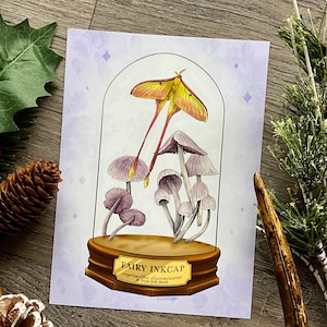 May include: A print depicting a yellow and orange moth and purple mushrooms under a glass dome. The print includes the text "Fairy Inkcap" and the mushroom's scientific name. The background is light purple with diamond shapes.