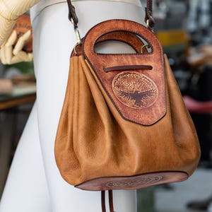 Leather Drawstring Bucket Bag. Dark Brown and light brown color.
