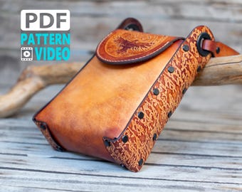 May include: A brown leather crossbody bag with a flap closure and a decorative design on the front. The bag has a strap and is adorned with metal studs.