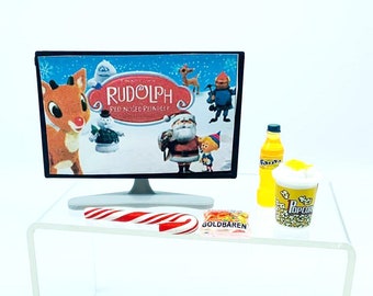 Accesorio para una noche de cine de elfos: Mini televisor, bocadillos y escena navideña