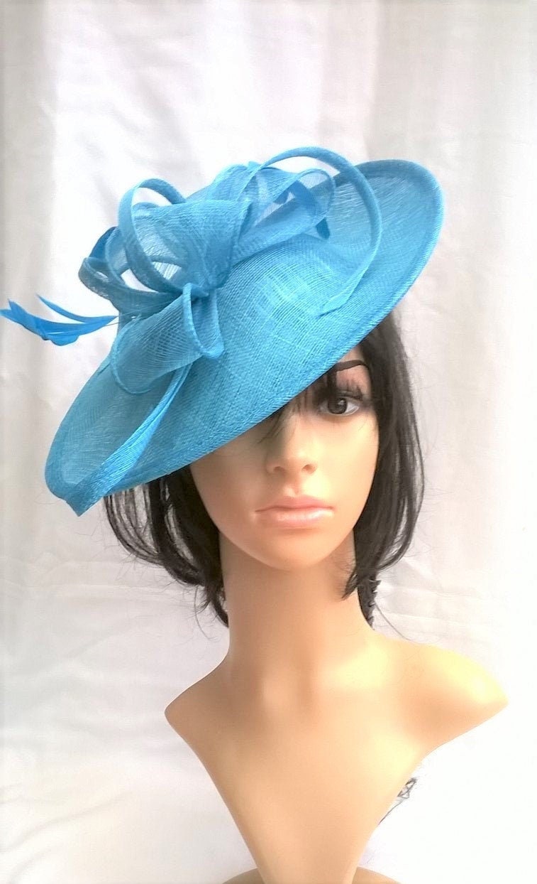 Turquoise Fascinator..Stunning Turquoise Blue Sinamay shaped Fascinator