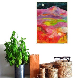 May include: A colorful abstract painting of a landscape with a mountain range, trees, and a full moon in the night sky. The painting is done in shades of pink, purple, green, and yellow.