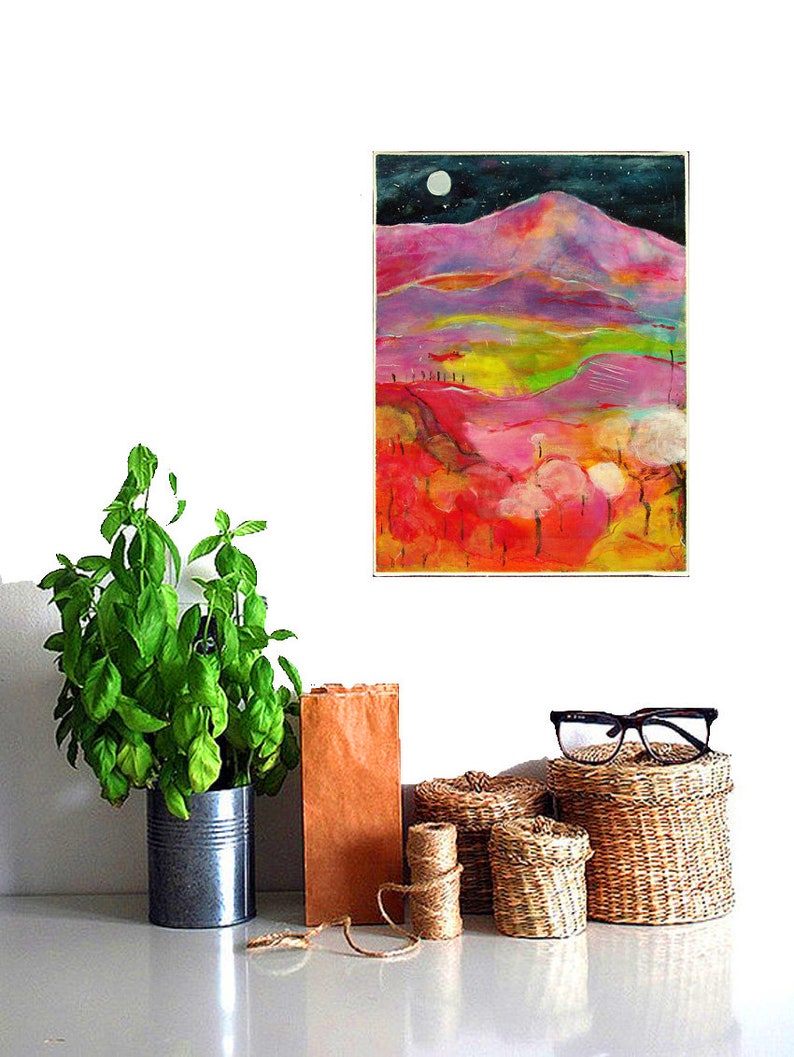 May include: A colorful abstract painting of a landscape with a mountain range, trees, and a full moon in the night sky. The painting is done in shades of pink, purple, green, and yellow.