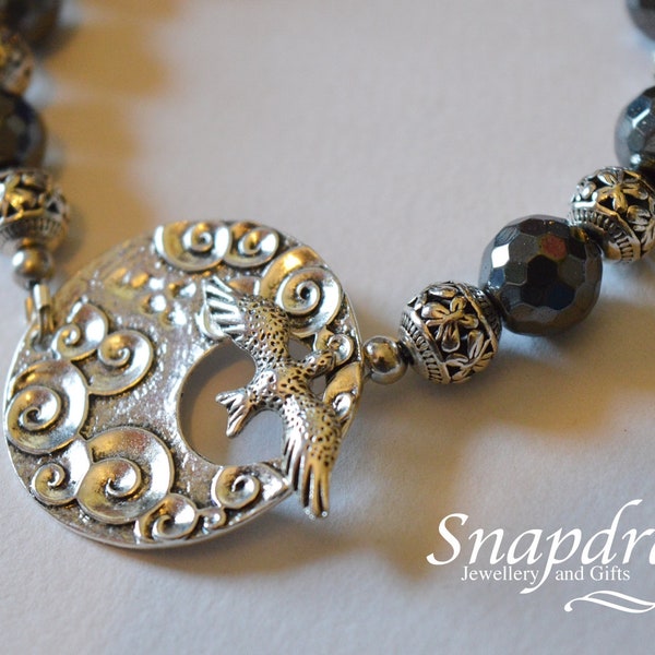 Ladies bracelet, Faceted Haematite bead bracelet with an ornate bird clasp with Tibetan silver spacer beads, ladies jewellery