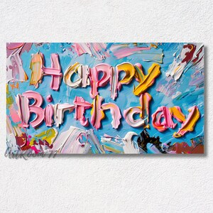 May include: A colourful abstract painting with the words "Happy Birthday" written in pink, yellow and white paint on a blue background.