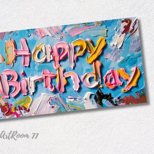 May include: A colourful abstract painting with the words "Happy Birthday" painted in pink, yellow and white on a blue background.