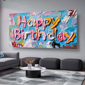 May include: A colourful abstract painting with the words "Happy Birthday" written in pink, yellow and blue paint.