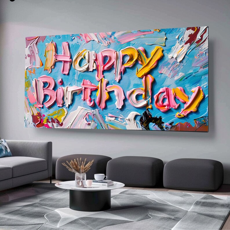 May include: A colourful abstract painting with the words "Happy Birthday" written in pink, yellow and blue paint.
