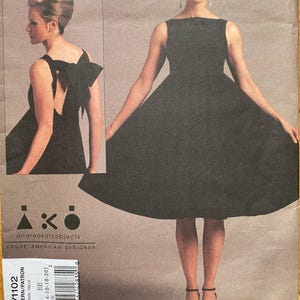 May include: A handmade wooden sign with the text "Welcome" in a handwritten style. The sign is painted white with a distressed finish and features a decorative floral design in shades of pink and green. It is designed to be hung on a wall.