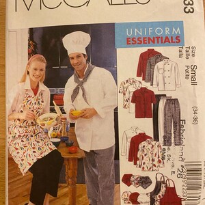 May include: McCall's M2233 sewing pattern for Uniform Essentials. The pattern features a chef and a woman wearing aprons. The pattern includes illustrations of chef coats, aprons, and pants. The size is small (34-36).