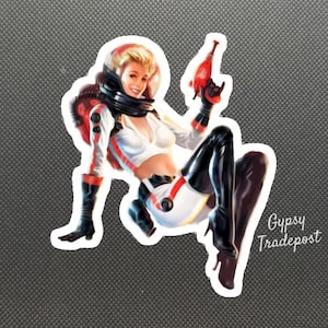 May include: A vintage-style illustration of a woman in a white and black space suit holding a red and black ray gun. She is wearing a helmet and has blonde hair. The image is in a retro style and has a whimsical feel.