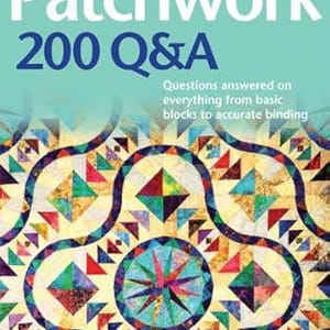 May include: A book titled "Patchwork 200 Q&A" with a colorful patchwork quilt design on the cover. The book cover features a blue background with white text and a colorful quilt design with a variety of shapes and colors.