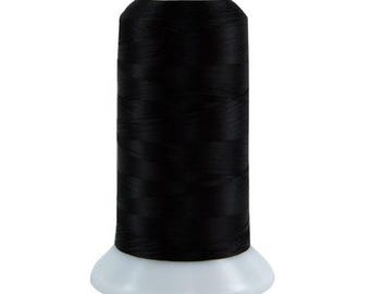 May include: A spool of black thread for sewing or embroidery.
