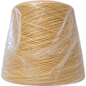 May include: A large, conical spool of light tan yarn wrapped in clear, crinkled plastic film. The yarn is wound tightly in a consistent diagonal pattern around the central core, creating a smooth, uniform texture across the entire surface.