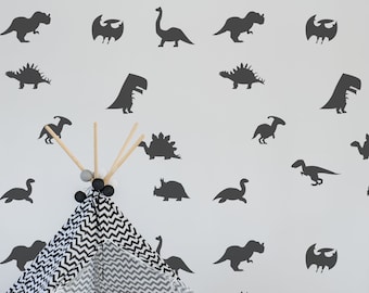 May include: A black and white teepee tent with a chevron pattern is set up in a room with a white wall. The wall is decorated with black dinosaur silhouettes.
