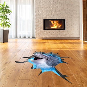 May include: A 3D floor sticker of a dolphin jumping out of a blue pool of water. The sticker is designed to look like the dolphin is breaking through the floor.