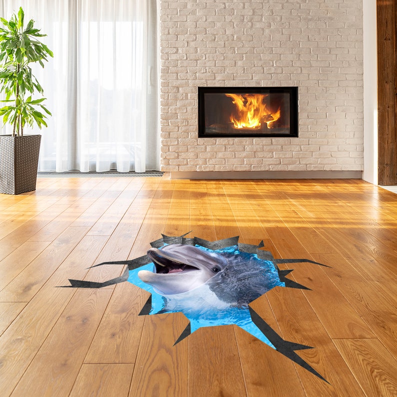 May include: A 3D floor sticker of a dolphin jumping out of a blue pool of water. The sticker is designed to look like the dolphin is breaking through the floor.