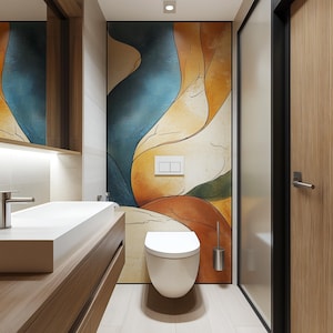 May include: A modern bathroom with a white toilet and a sink with a wooden vanity. The wall behind the toilet features an abstract art print with blue, yellow, and orange colors.