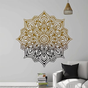 May include: A large, intricate mandala wall decal in shades of brown and black. The mandala features a circular design with multiple layers of intricate patterns.