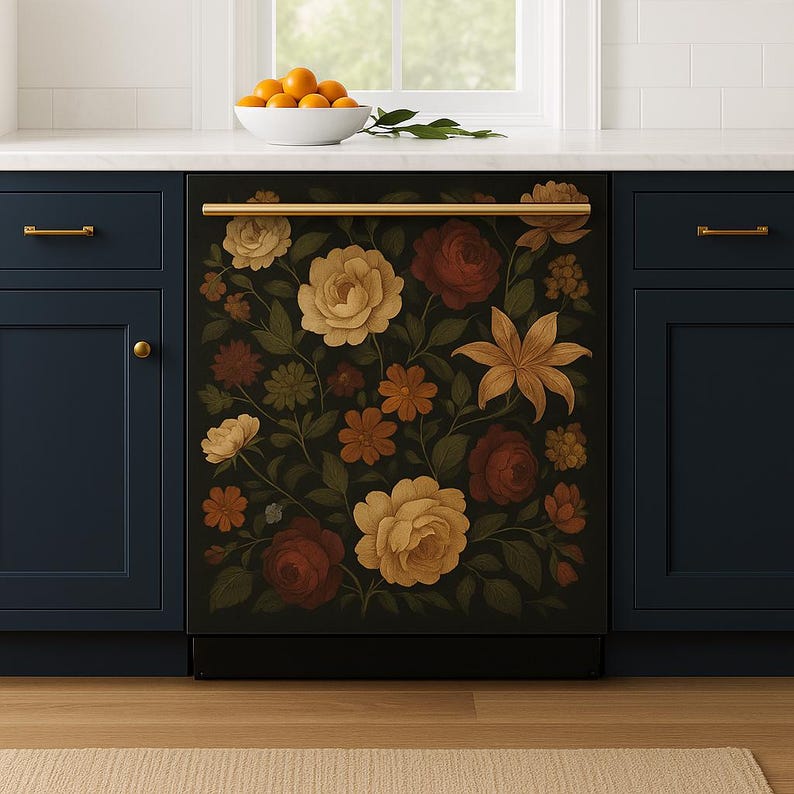 A navy kitchen features a dishwasher panel wrapped in a dark floral decal with detailed illustrations of vintage roses, lilies, and golden blooms, creating a warm, romantic focal point beneath a white countertop.