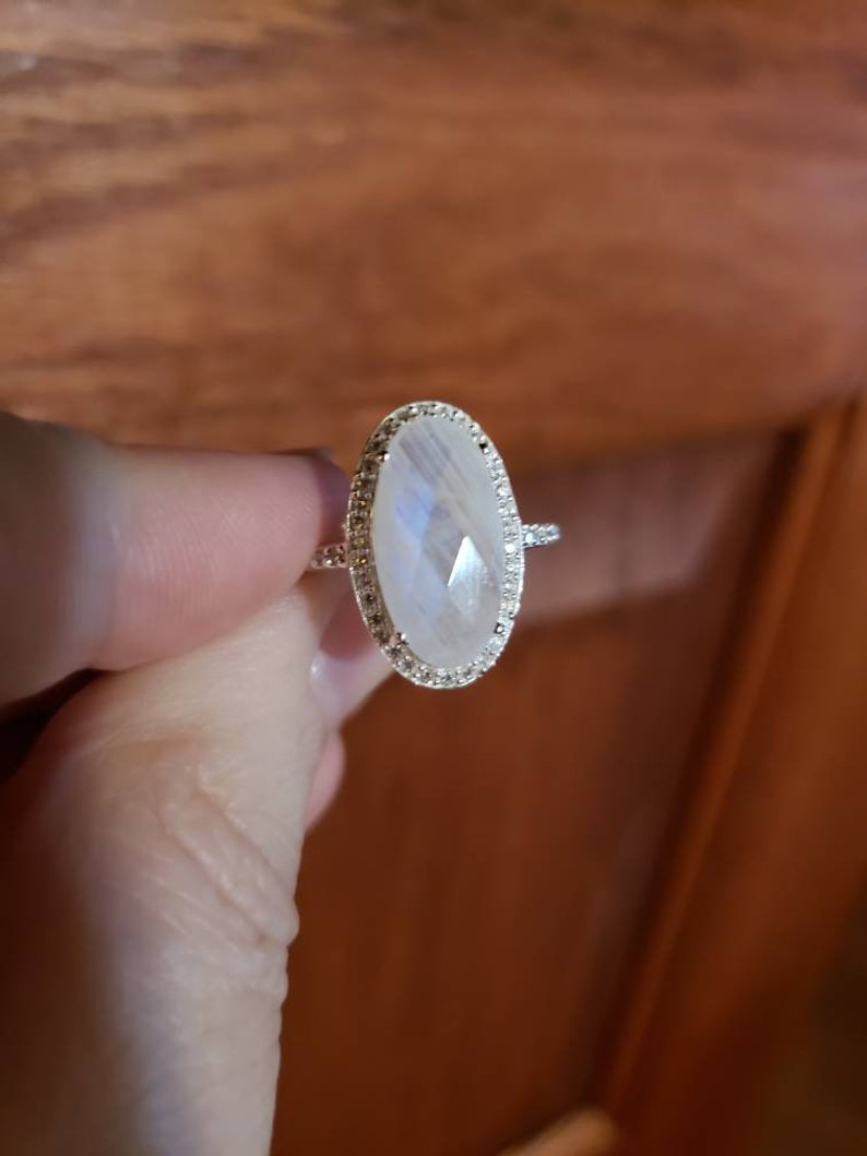 Oval Rainbow Moonstone Ring with Cubic Zirconia Halo Sterling Silver Oval Rainbow Moonstone Ring with Cubic Zirconia Halo Sterling Silver
