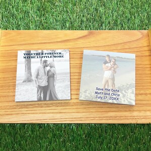 Custom photo save the date Post-it notes displayed on a wooden tray, featuring personalized images and wedding date text