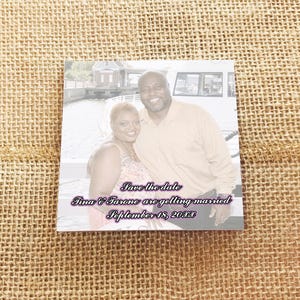 Square Post-it note save the date with a couple’s photo and wedding announcement text printed on a sticky note