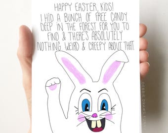May include: A white bunny with pink ears and blue eyes is drawn on a white card. The card has the text "HAPPY EASTER, KIDS! I HID A BUNCH OF FREE CANDY DEEP IN THE FOREST FOR YOU TO FIND & THERE'S ABSOLUTELY NOTHING WEIRD & CREEPY ABOUT THAT." and "DEBBIE DRAWS FUNNY" at the bottom.