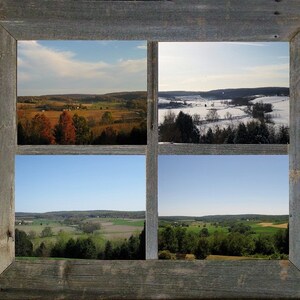 May include: A rustic wooden frame with four windows showcasing different seasons of a rural landscape. The top left window shows a fall scene with colorful trees, the top right window shows a winter scene with snow-covered fields, the bottom left window shows a spring scene with green fields, and the bottom right window shows a summer scene with lush green trees.