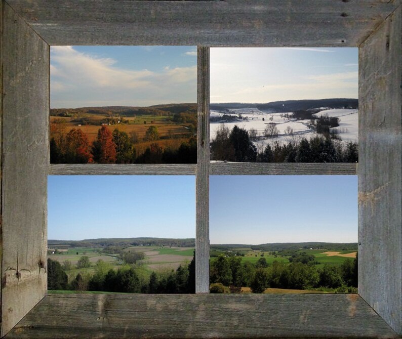 May include: A rustic wooden frame with four windows showcasing different seasons of a rural landscape. The top left window shows a fall scene with colorful trees, the top right window shows a winter scene with snow-covered fields, the bottom left window shows a spring scene with green fields, and the bottom right window shows a summer scene with lush green trees.