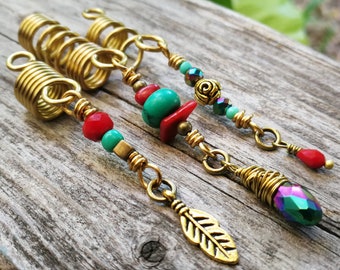 May include: Three gold hair coils with red and turquoise beads and a gold feather charm. The coils are made of wire and have a springy design. The beads are strung on wire and have a variety of shapes and sizes. The feather charm is attached to the end of the coil with a wire loop.