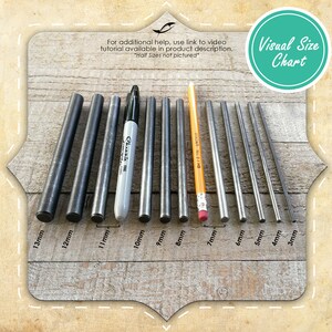 May include: Visual size chart displaying 10 different sizes of metal rods, ranging from 3mm to 13mm in diameter. The rods are arranged in order of size, with the smallest rod on the right and the largest rod on the left. The chart also includes a pencil and a marker for scale.
