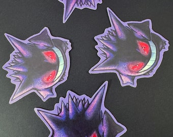May include: Four purple and black Gengar Pokemon stickers with red eyes and a wide grin. The stickers are on a black background.