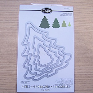 May include: A package of Sizzix Framelits dies for Christmas tree shapes. The package includes four dies in graduated sizes, with the largest die measuring approximately 4 inches in height. The package also includes the text "4 Dies 4 Poissons 4 Troqueles".