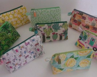 Makeup bag/pouch/case. Cosmetics Toiletry, flat-bottom w/zipper closure and decorated tassel 6 3/4"W x 4 1/2" H x 3" D