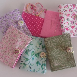 Needle Book w/2 pockets, button & elastic closure. 3 1/2" tall x 2 3/4" wide. Cotton, lined, lightly padded