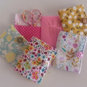 Needle Book w/2 pockets, button & elastic closure. 3 1/2" tall x 2 3/4" wide. Cotton, lined, lightly padded