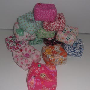 Pincushions, weighted with crushed walnut shells. 3 1/4&quot; W x 1 1/4&quot; H. Cotton fabric, many print selections