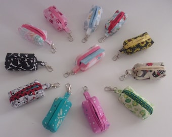 Dog Waste Bag Holder. Fabric, lined, lobster clasp. 2 5/8" x 1". Waste roll included.