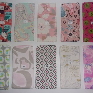 May include: Ten rectangular fabric pouches arranged in two rows, each labeled with a number from 11 to 20. The pouches feature various colorful patterns including owls, paisley, floral, geometric shapes, birds, and text reading "They keep calling me Mom".