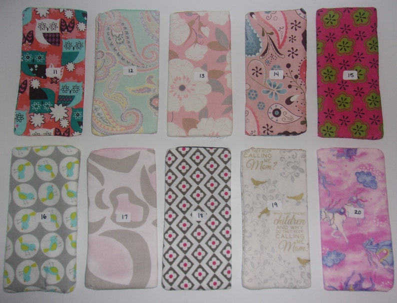 May include: Ten rectangular fabric pouches arranged in two rows, each labeled with a number from 11 to 20. The pouches feature various colorful patterns including owls, paisley, floral, geometric shapes, birds, and text reading "They keep calling me Mom".