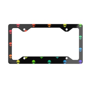 May include: Black license plate frame with a repeating pattern of colorful alien faces.