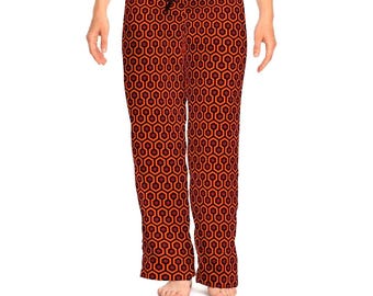 May include: Orange and black patterned pajama pants with a geometric design. The pants have a drawstring waistband.