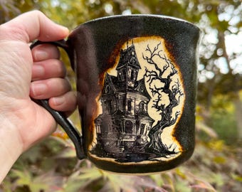 Haunted House Stoneware Mug: Sparkling Black Halloween Coffee Cup