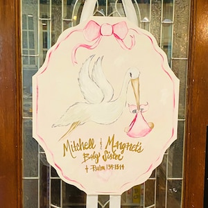 Baby stork or cross door hanger