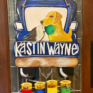 Truck filled for duck and deer hunters and baby door hanger