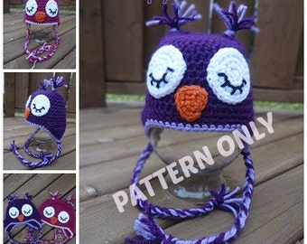 May include: Purple crochet owl hat with white eyes and an orange beak. The hat has a long purple and white tie. The text "Sleepy Owl Hat" and "Pattern Only" are visible in the image.
