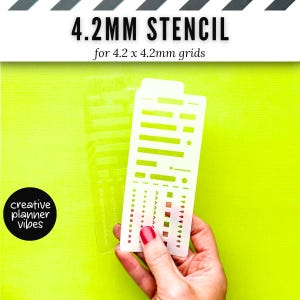 May include: A clear plastic stencil for 4.2mm grids featuring various geometric shapes, lines, and icons. The text 4.2MM STENCIL for 4.2 x 4.2mm grids is displayed at the top, and a black circular logo reads creative planner vibes.